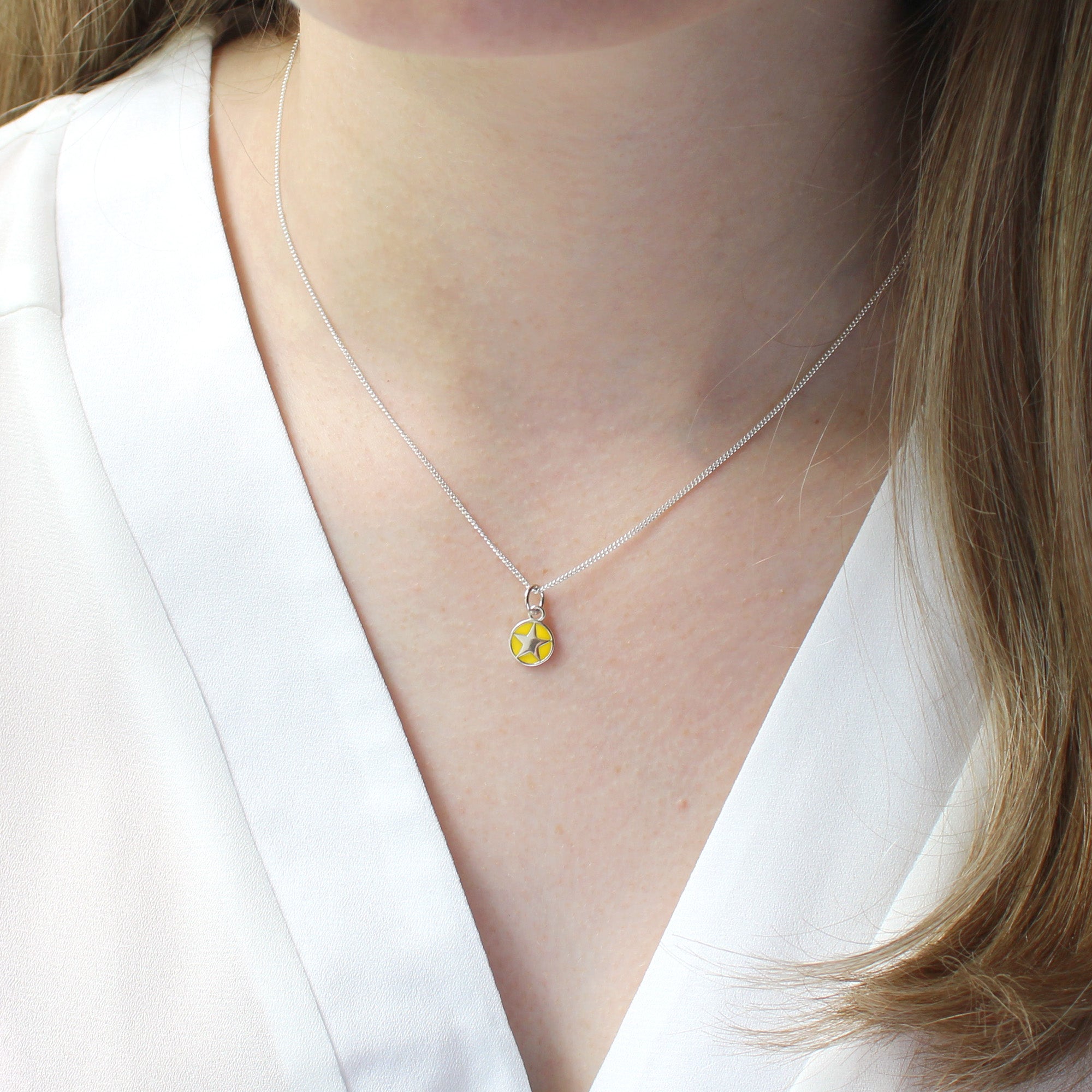 Mini enamel star pendant, silver, yellow, detail