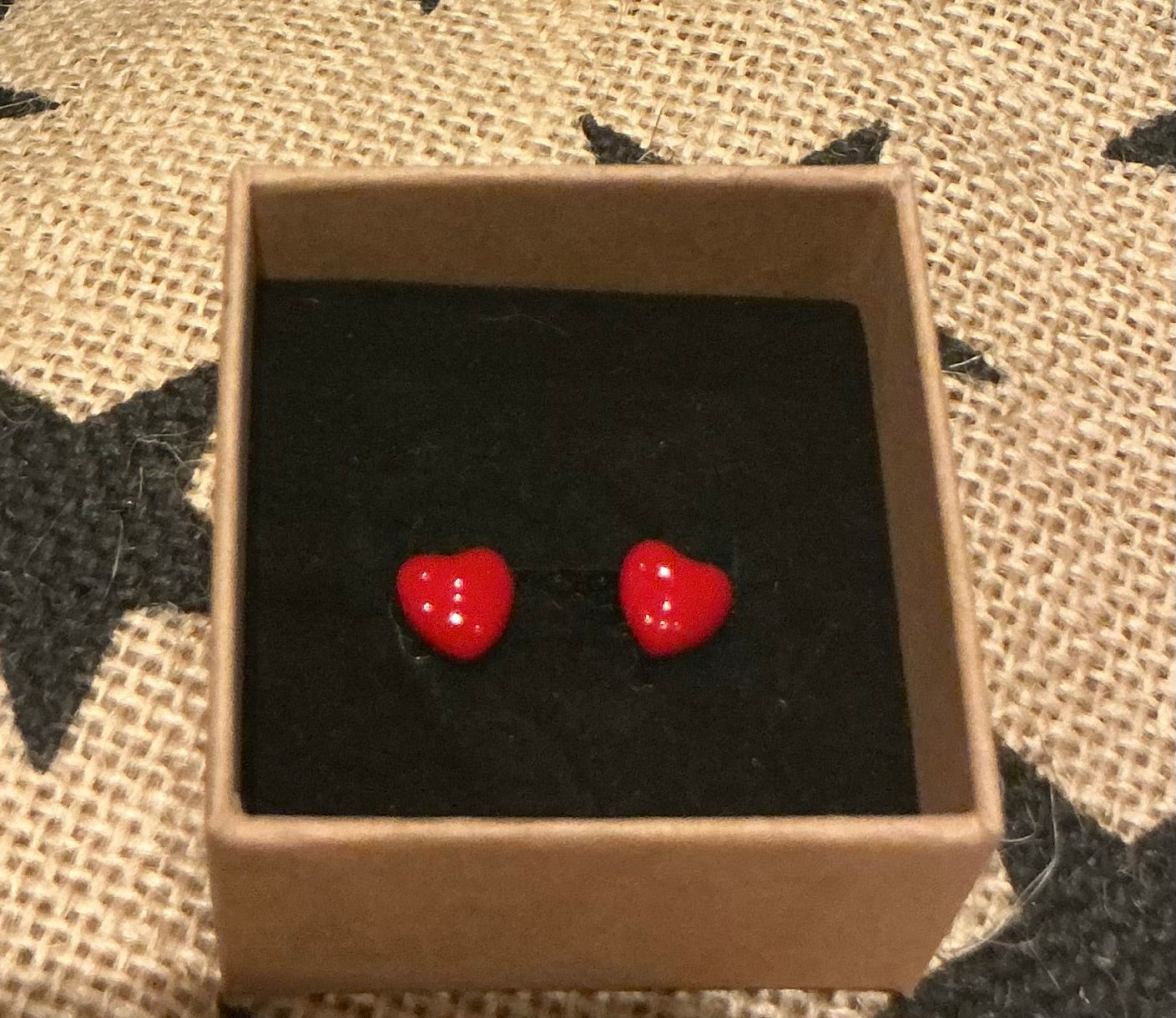 Small red enamel heart stud earrings set in silver