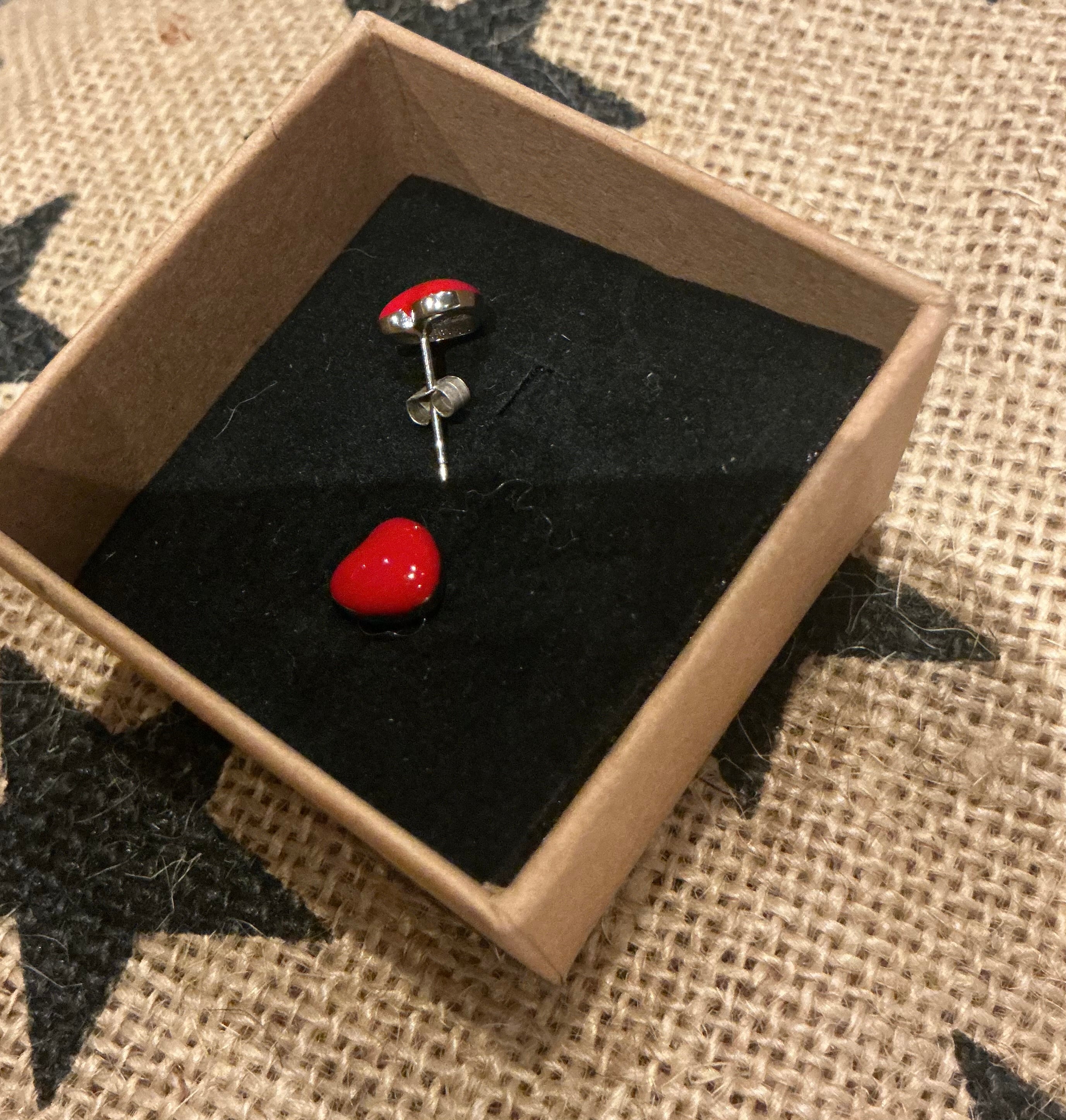 Small red enamel heart stud earrings set in silver