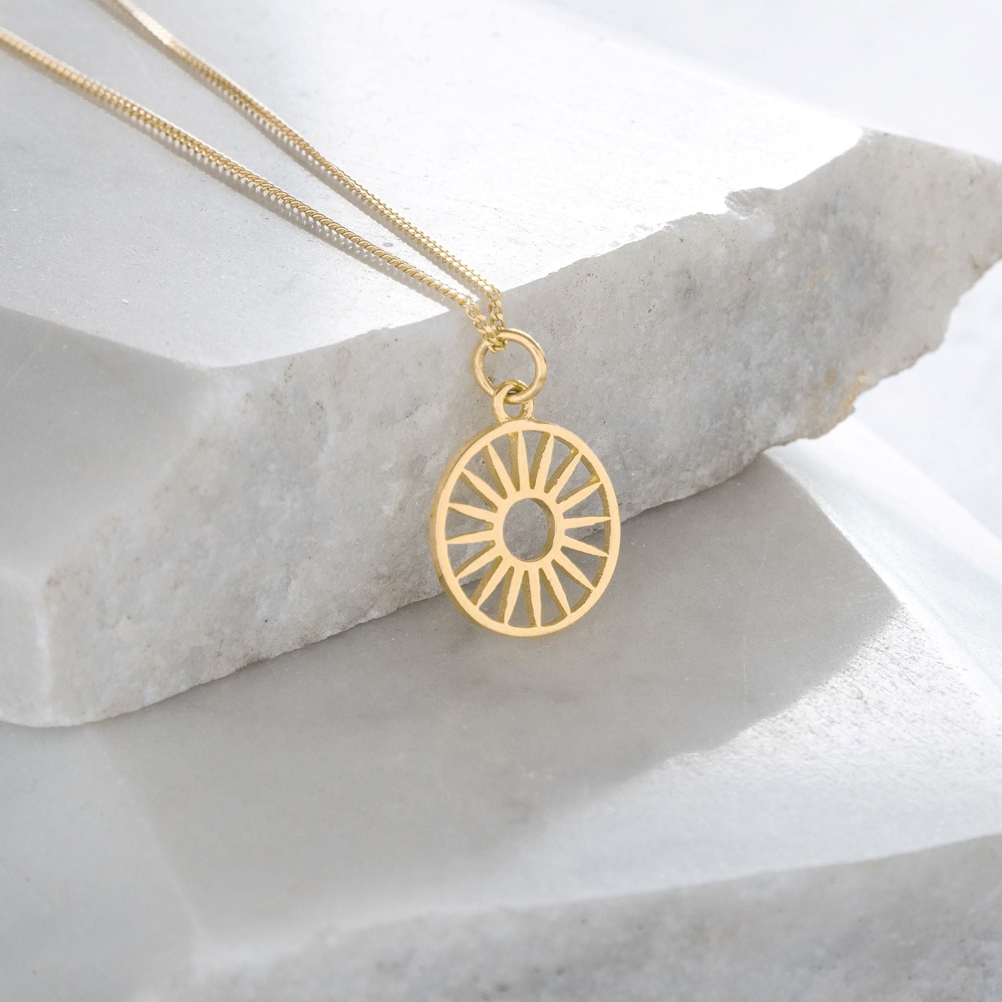 Token charm necklace, wagon wheel, gold vermeil
